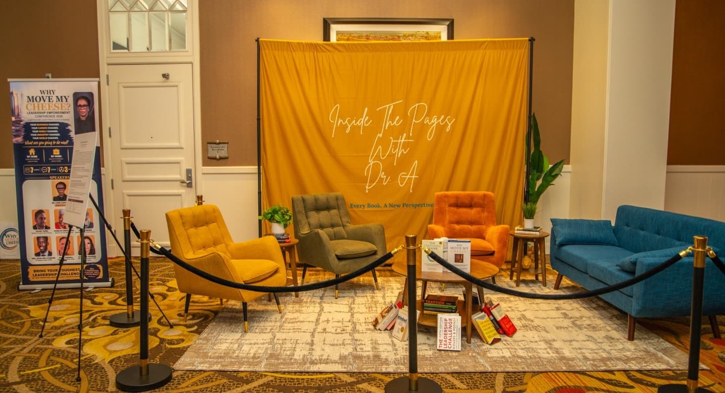 The Inside the Pages with Dr. A set: mustard backdrop, armchairs and reading lounge