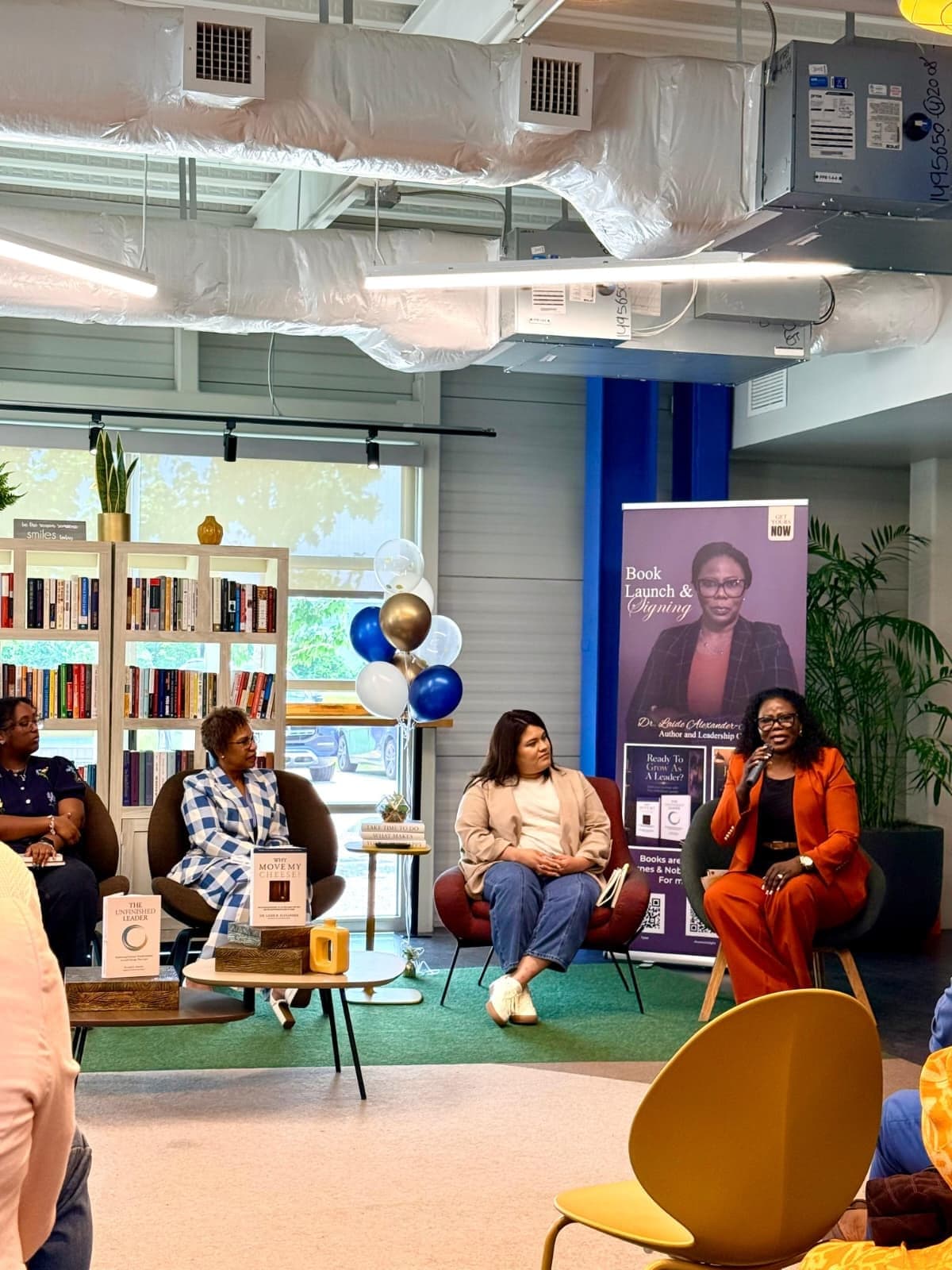 The book launch panel in front of a full room