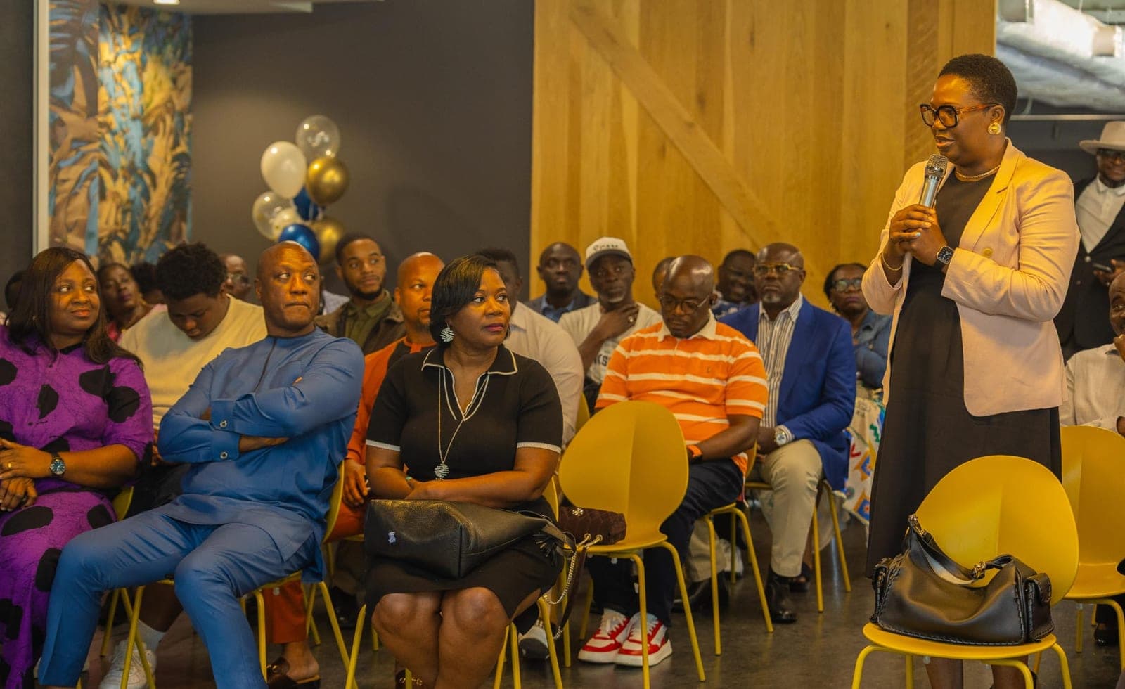 Guests listening at the book launch