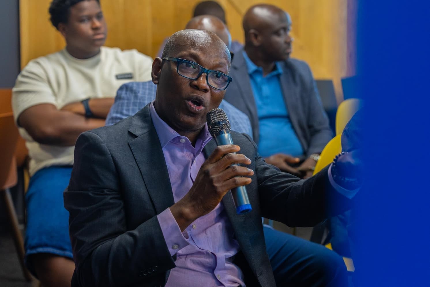 A guest sharing his thoughts with the microphone