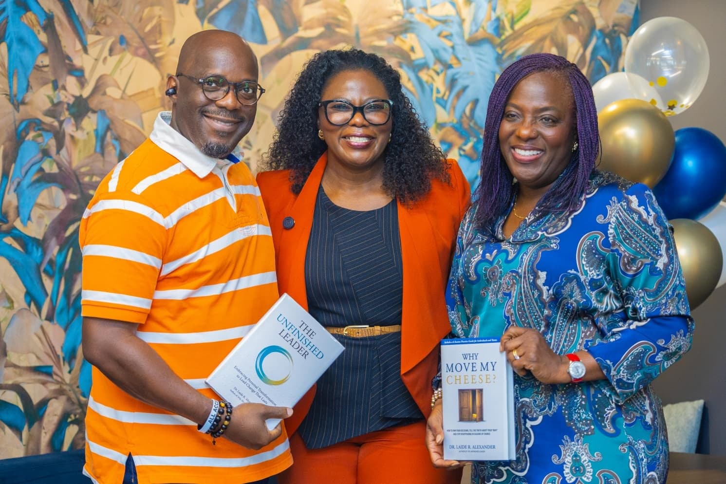 Dr. Laide Alexander with readers and their books