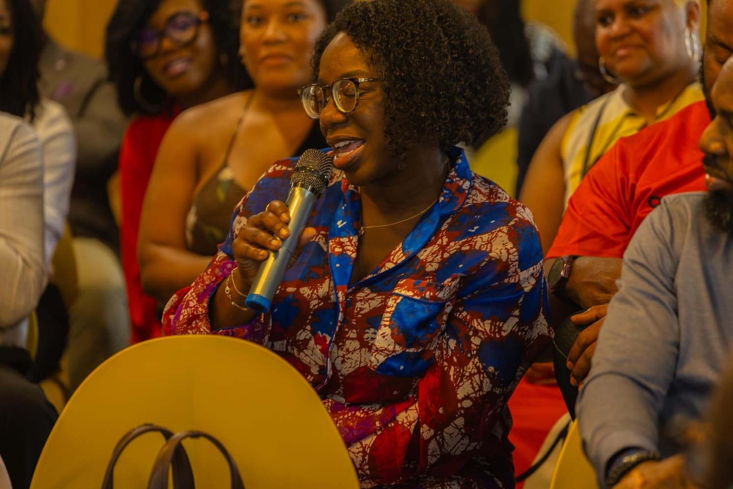 A guest sharing a story with the microphone
