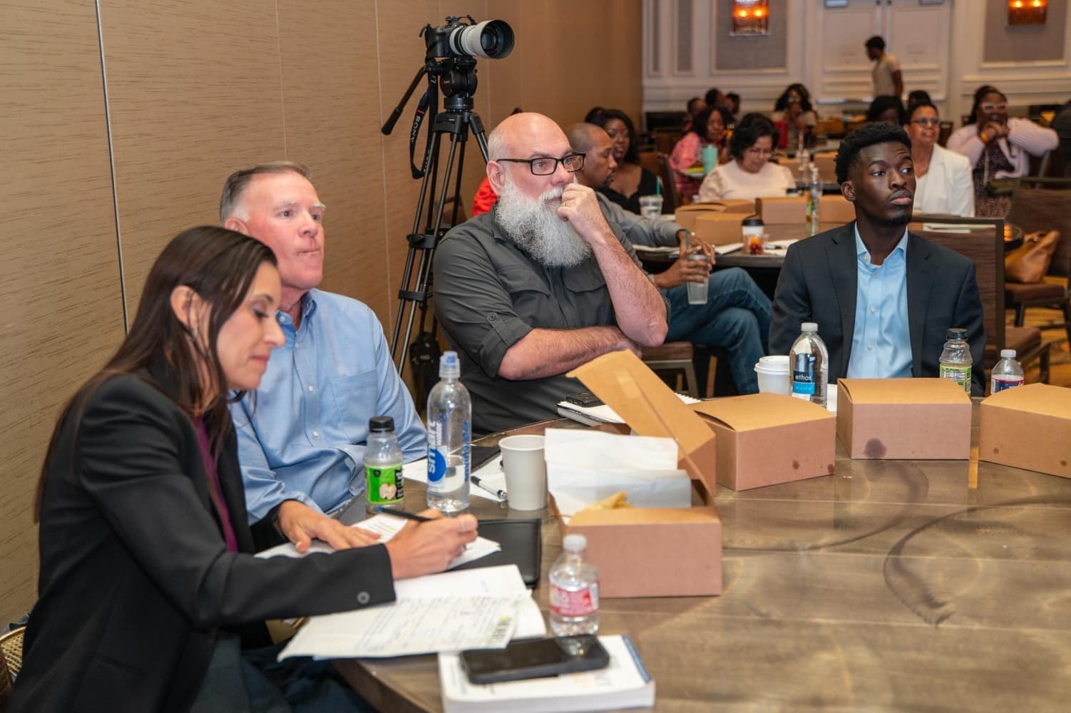 Attendees working through their conference materials