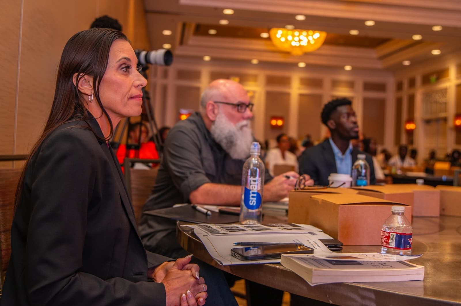 Attendees at a table during a session